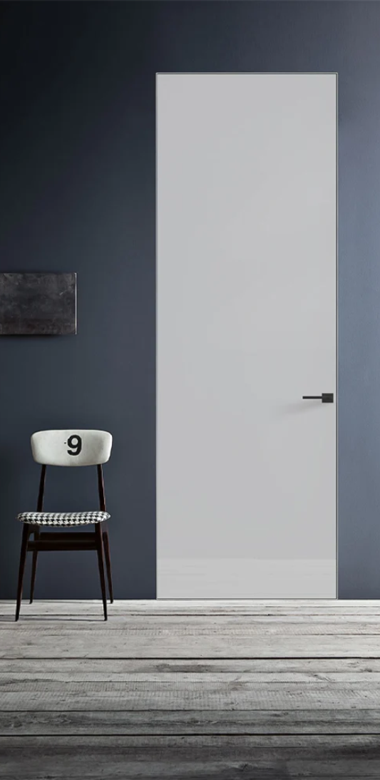 White door with a chair and number 9 against a dark gray wall